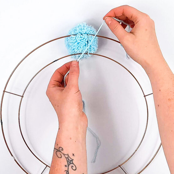 Christmas-Stash-Busting-Ideas_Pompom-Wreath-Step-2.jpg?sw=554&q=85