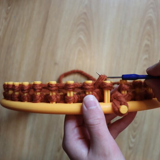 how_to_loom_knit_a_twisted_ear_warmer_step_5d.jpg?sw=554&q=85