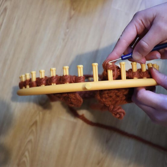 how_to_loom_knit_a_twisted_ear_warmer_step_8h.jpg?sw=554&q=85