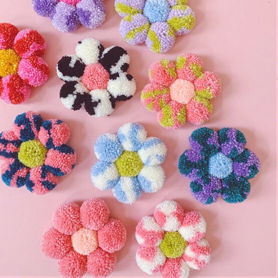 How_to_make_a_Pom_Pom_Flower_Wall_Hanging_cropped.jpg?sw=554&q=85