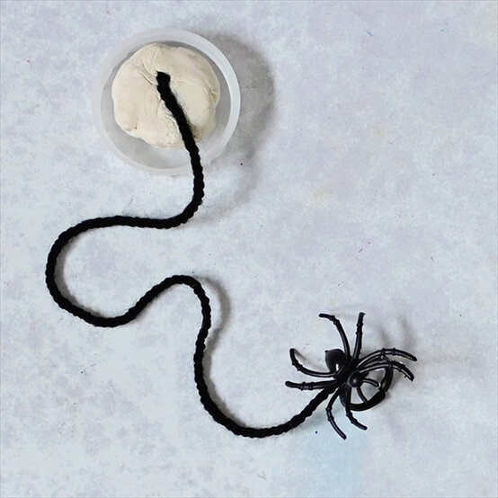 how-to-make-halloween-milk-bottle-lanterns_spiders-a.jpg?sw=554&q=85