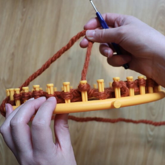 how_to_loom_knit_a_twisted_ear_warmer_step_6c.jpg?sw=554&q=85