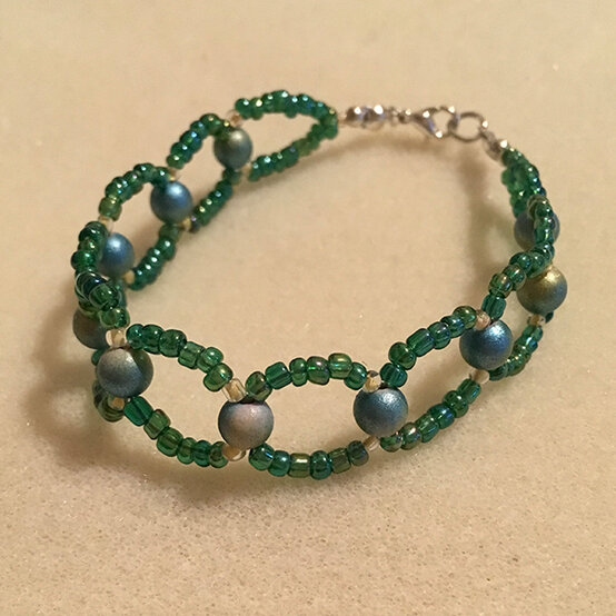 artisan-anna-stewart-green-infinite-loop-bracelet.jpg?sw=554&q=85