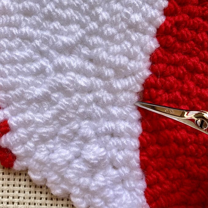 how-to-punch-needle-a-candy-cane-cushion_step_7_tidying_stitches.jpg?sw=680&q=85