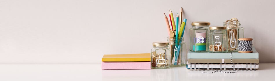 A desk filled with craft supplies