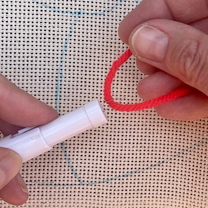 how-to-punch-needle-a-candy-cane-cushion_step_3b_threading_needle2.jpg?sw=680&q=85