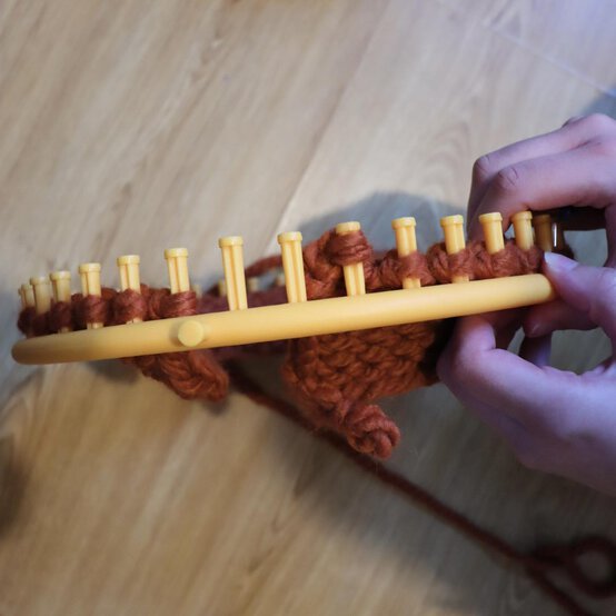 how_to_loom_knit_a_twisted_ear_warmer_step_8i.jpg?sw=554&q=85