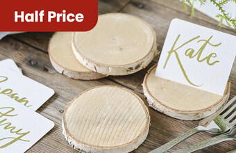Wooden Slices on a table with name plates and cutlery. A half price' badge. Clicking leads to wedding multipacks.