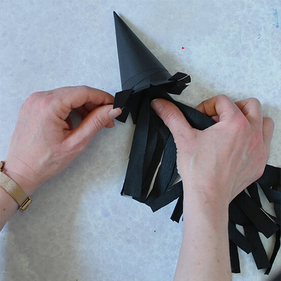 how-to-make-halloween-milk-bottle-lanterns_witch-d.jpg?sw=554&q=85