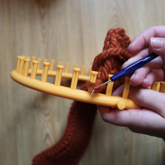 how_to_loom_knit_a_twisted_ear_warmer_step_8k.jpg?sw=554&q=85