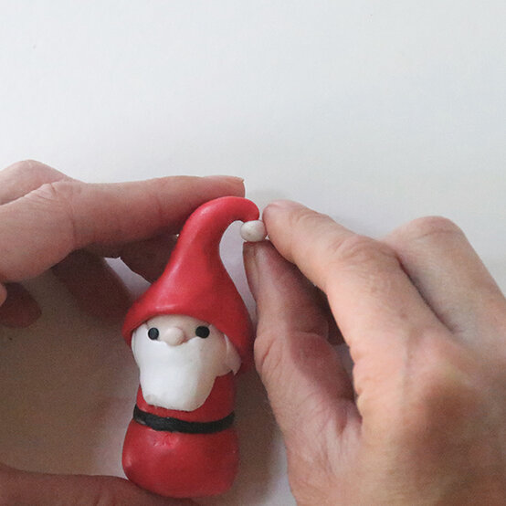 how-to-make-fimo-snow-globes_santa-5.jpg?sw=554&q=85