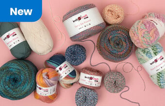 Various balls of yarn on a pink background. New badge. Clicking leads to new yarn.