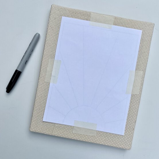 how-to-make-a-punch-needle_sunburst_attaching_template_step_1.jpg?sw=554&q=85