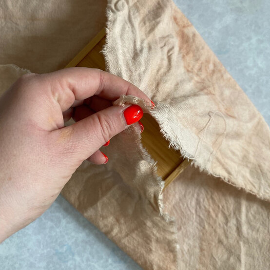 fabric_gift_wrap_knot_step_7.jpg?sw=554&q=85