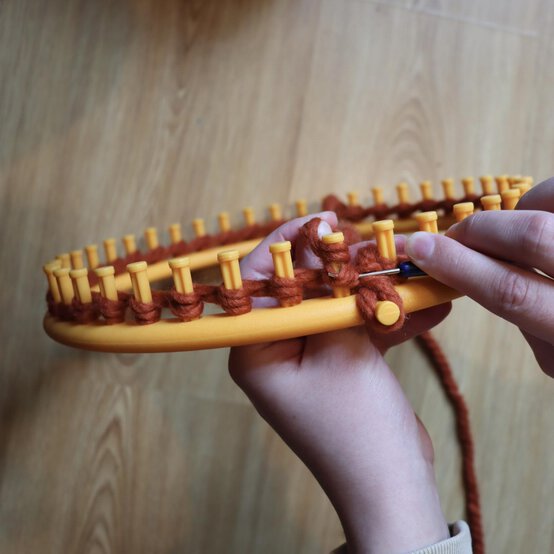 how_to_loom_knit_a_twisted_ear_warmer_step_3b.jpg?sw=554&q=85