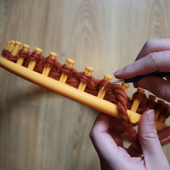 how_to_loom_knit_a_twisted_ear_warmer_step_6a.jpg?sw=554&q=85