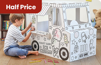 A boy sat colouring in an ice cream colour-in cardboard playhouse. Half Price badge. Clicking leads to all colour-in cardboard playhouses in the offer.