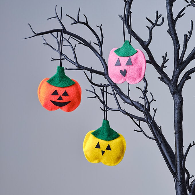 ways-to-decorate-a-twig-tree-for-halloween-felt-pumpkins.jpg?sw=680&q=85