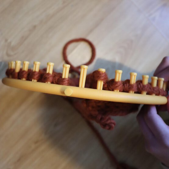 how_to_loom_knit_a_twisted_ear_warmer_step_8e.jpg?sw=554&q=85