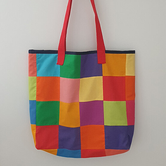 artisan-eden-forbes-rainbow-elmer-tote-bag.jpg?sw=554&q=85