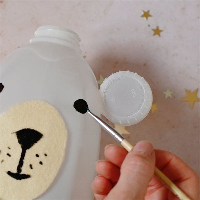 how-to-make-winter-milk-bottle-lanterns_polar-bear-c.jpg?sw=680&q=85