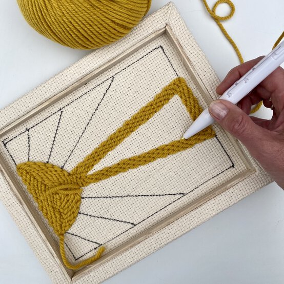 how-to-make-a-punch-needle_sunburst_first_ray_section-step__10.jpg?sw=554&q=85