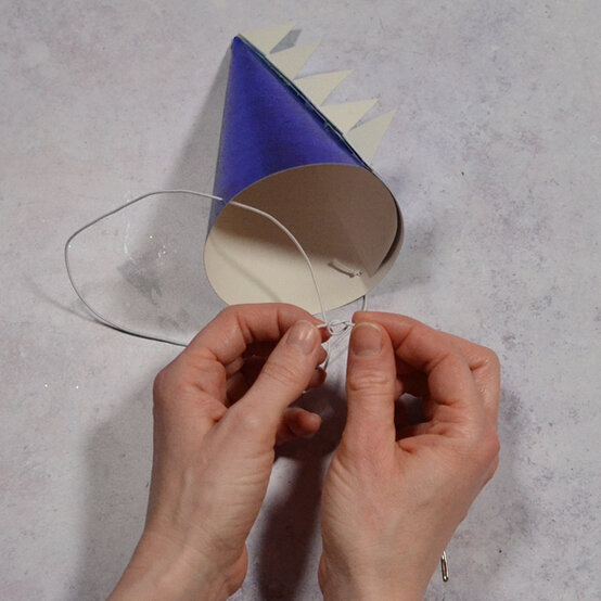 how_to_make_dinosaur_party_hats_craft_activities_step4a.jpg?sw=554&q=85