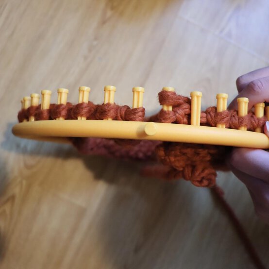 how_to_loom_knit_a_twisted_ear_warmer_step_8c.jpg?sw=554&q=85