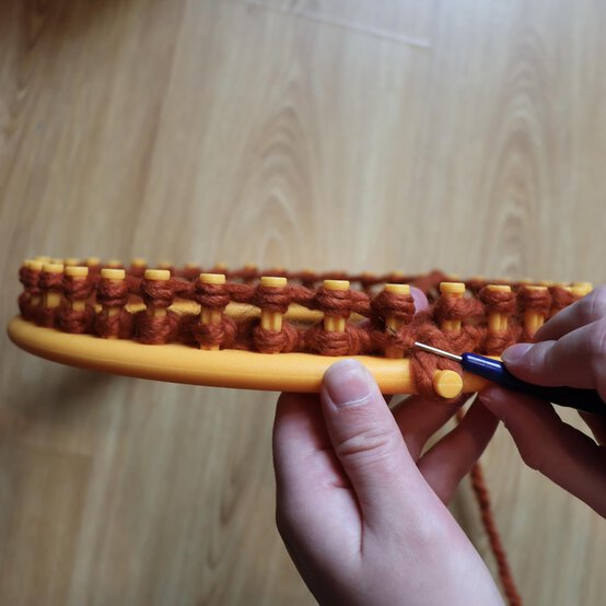 how_to_loom_knit_a_twisted_ear_warmer_step_5c.jpg?sw=554&q=85