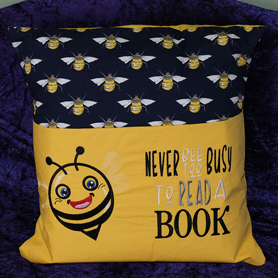 artisan-sharon-barton-bee-reading-cushion.jpg?sw=554&q=85