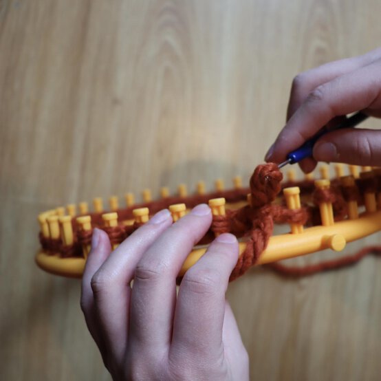 how_to_loom_knit_a_twisted_ear_warmer_step_6b.jpg?sw=554&q=85