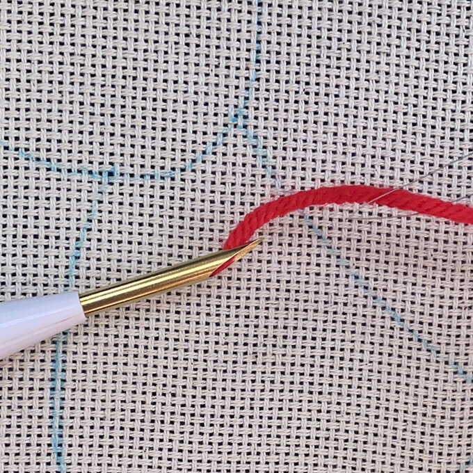 how-to-punch-needle-a-candy-cane-cushion_step_3c_threading_needle3.jpg?sw=680&q=85