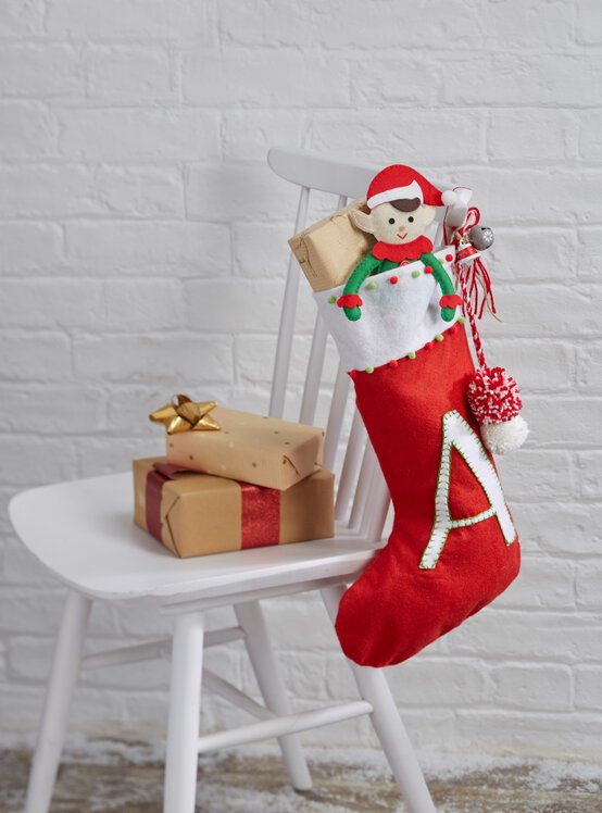 initial-pompom-stocking.jpg?sw=554&q=85