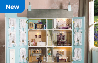A decorated Dolls House with furniture and dolls in it. New badge. Clicking leads to doll's house products.