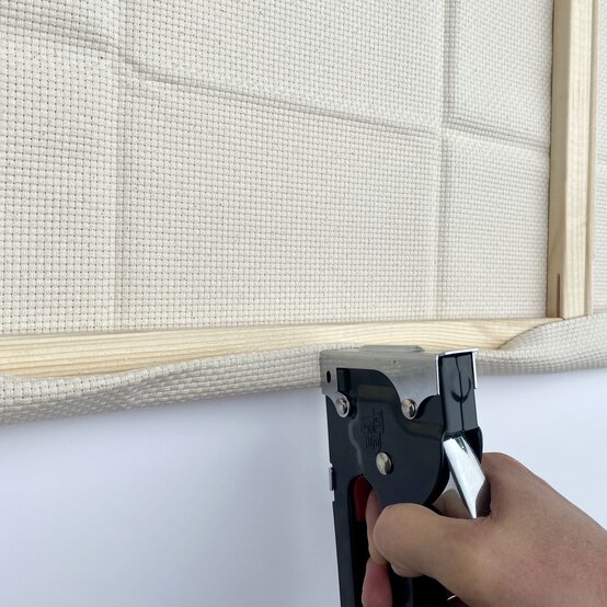 how-to-prepare-a-punch-needle-frame-step_5_first_staple.jpg?sw=554&q=85