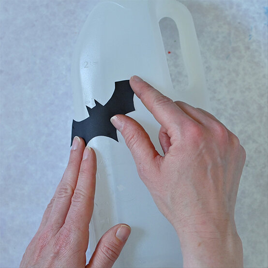how-to-make-halloween-milk-bottle-lanterns_bat-c.jpg?sw=554&q=85