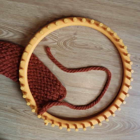 how_to_loom_knit_a_twisted_ear_warmer_step_8j.jpg?sw=554&q=85