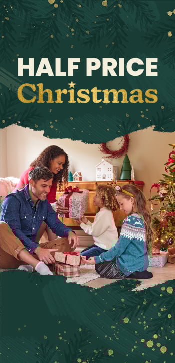 A family in a living room exchanging gifts next to a christmas tree. Text says make half price christmas. Clicking leads to the christmas page.