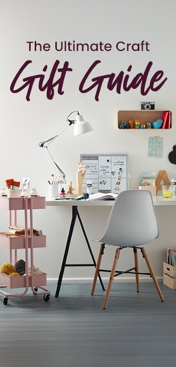 The ultimate craft gift guide text and images of a painting set next to a kingfisher watercolour, models and sprues on a cutting mat and a knitting bag and accessories. Clicking leads to gift guide.